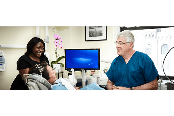 Dentists with patient smiling 2