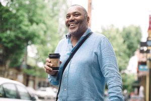 Guy smiling with coffee